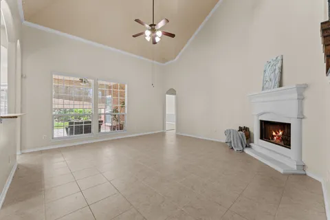 a view of livingroom with fireplace fan and window