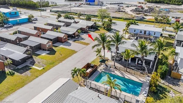 an aerial view of residential houses with outdoor space