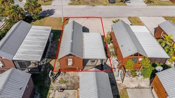 an aerial view of a house with a yard