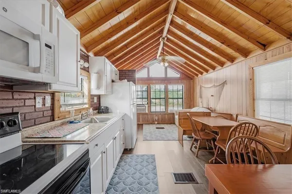 a kitchen that has a stove and a microwave