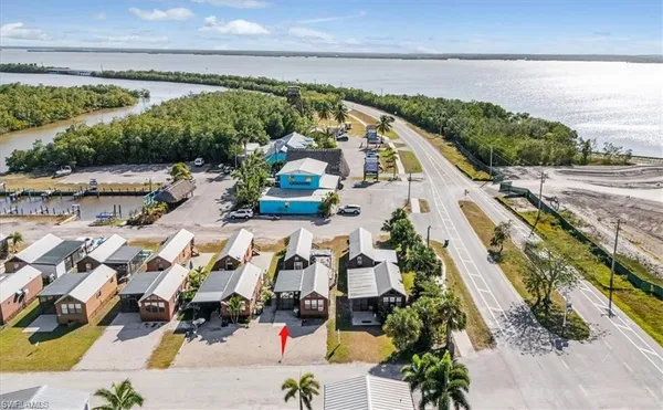 an aerial view of residential houses with outdoor space