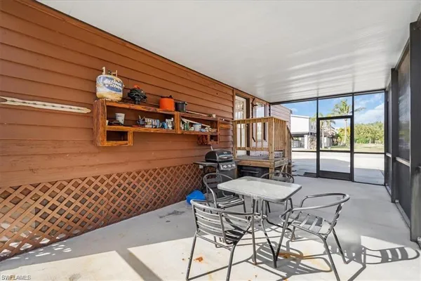 a view of a chairs and table in the patio