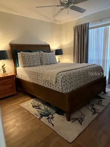 a living room with a couch and a chandelier