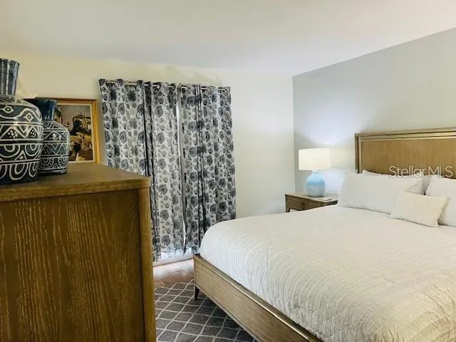 a bedroom with a bed and a walk in closet