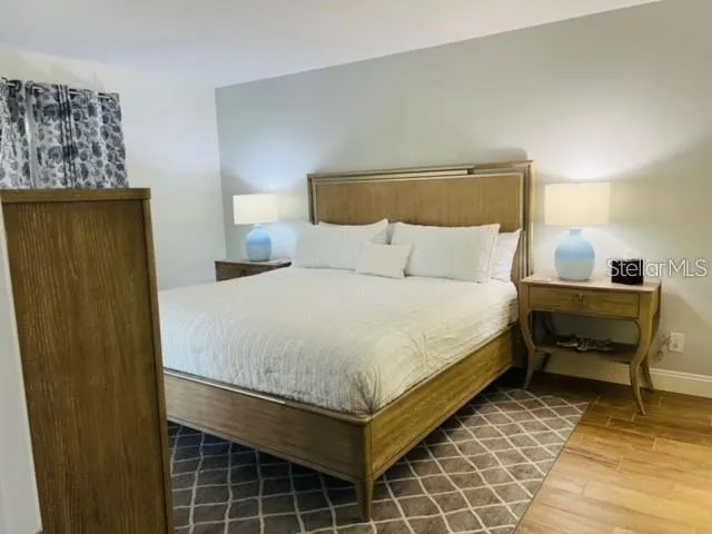 a bedroom with a bed and a table in it