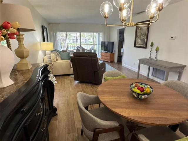 a living room with furniture flowerpot and window