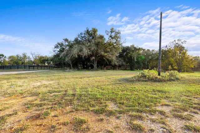 a view of a swimming pool and a yard