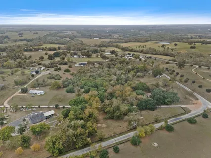 an aerial view of mountains with green space