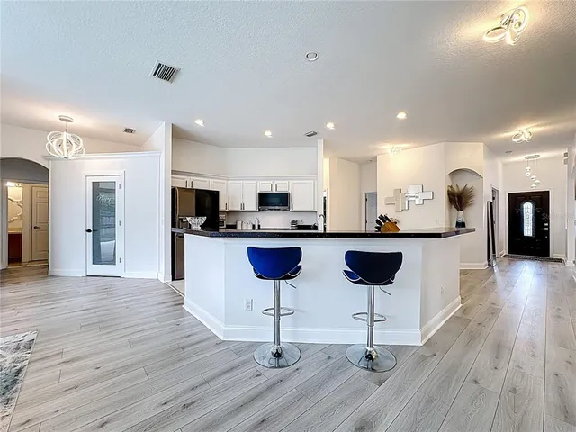 a view of a bathroom with bathtub sink and mirror