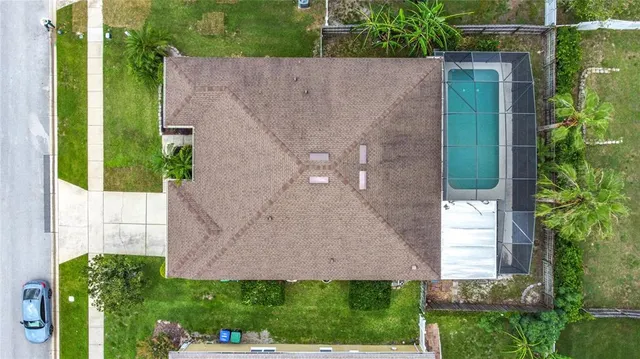 an aerial view of a house with a garden