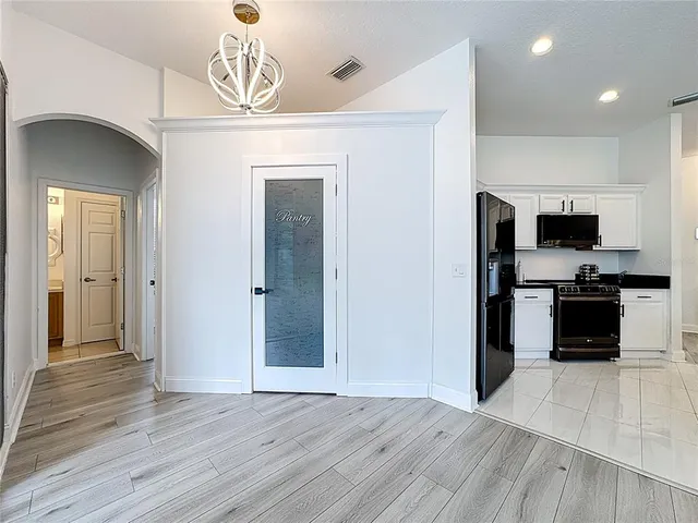 a outdoor space with couches a barbecue grill and a dining table with garden view