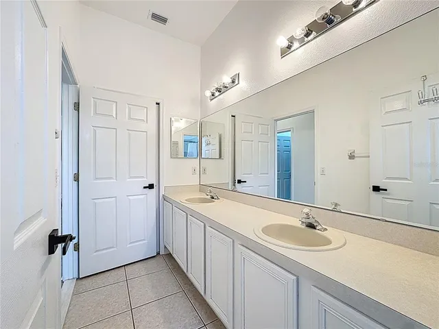 a view of a bathroom from the hallway