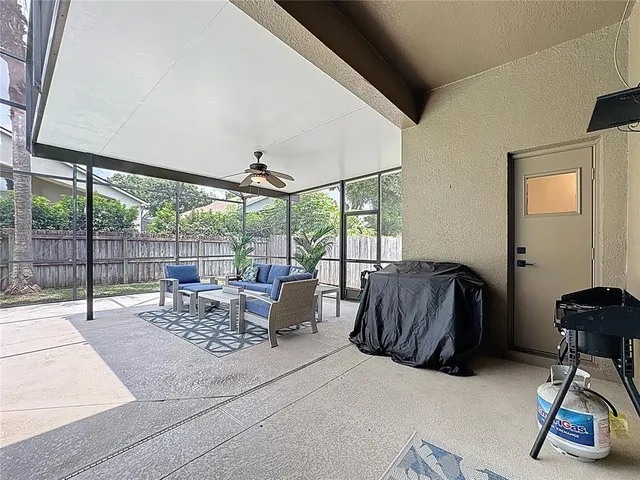 a spacious bathroom with a tub sink and mirror