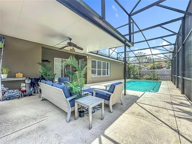 a view of swimming pool with seating area