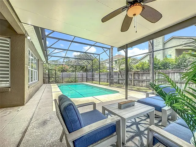 an aerial view of residential houses with outdoor space and parking