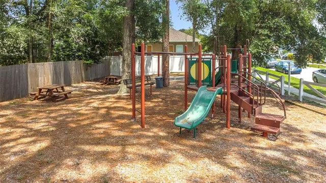 an aerial view of multiple houses with yard