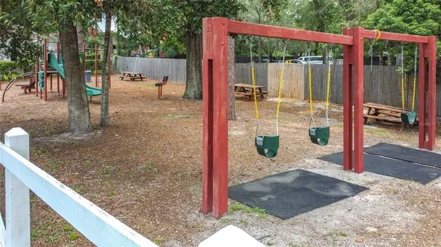 an aerial view of multiple houses with a yard