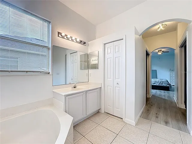 a kitchen with stainless steel appliances granite countertop a sink a stove top oven a counter space and cabinets