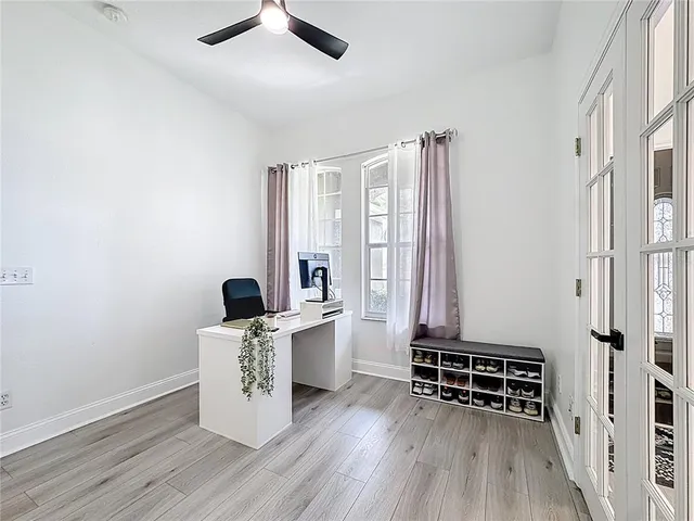 a kitchen with granite countertop a sink and cabinets