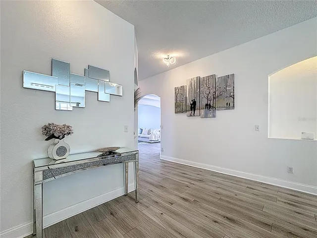 a kitchen with stainless steel appliances kitchen island granite countertop a sink and a stove