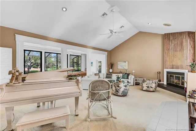 a living room with furniture and fireplace