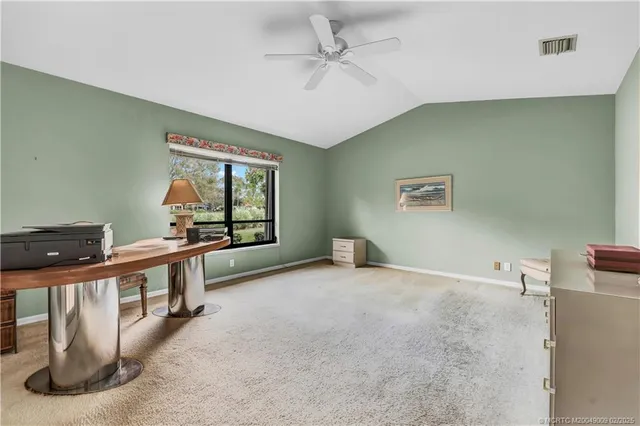 a view of a room with a large window