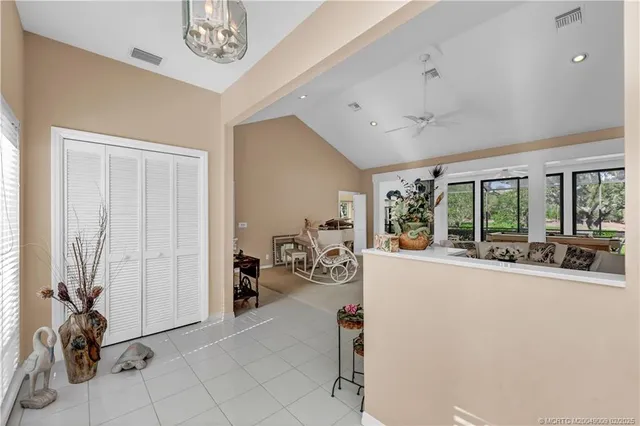 a view of a livingroom with furniture and a large window