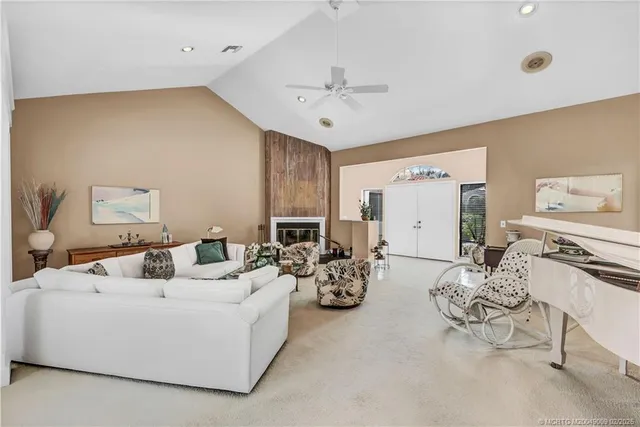 a living room with furniture and white walls