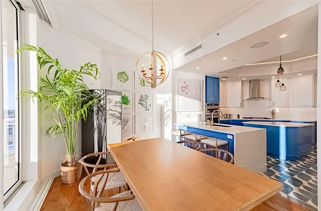 a kitchen with stainless steel appliances granite countertop a stove refrigerator and cabinets