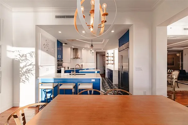 a kitchen with stainless steel appliances granite countertop a stove refrigerator and cabinets
