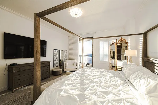 a bedroom with a bed and a table in it