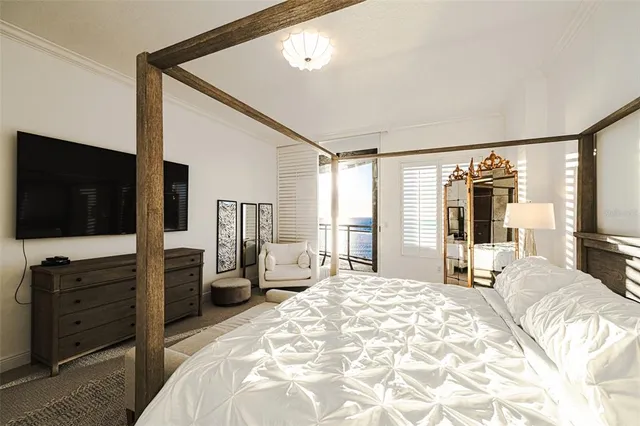 a bedroom with a bed and a table in it