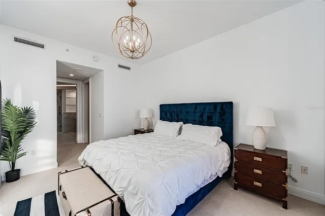 a view of a kitchen with a sink and refrigerator