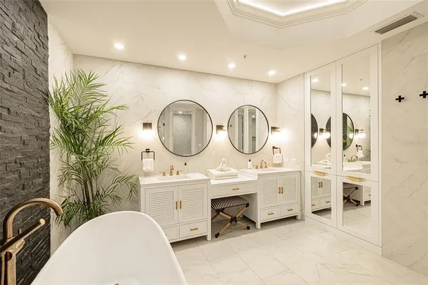 a bathroom with a bathtub and a shower