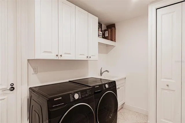 a view of a room with chairs and a window