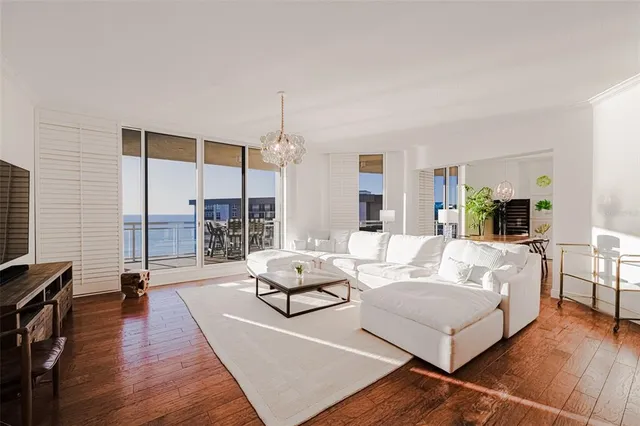 a living room with furniture or couch and a wooden floor