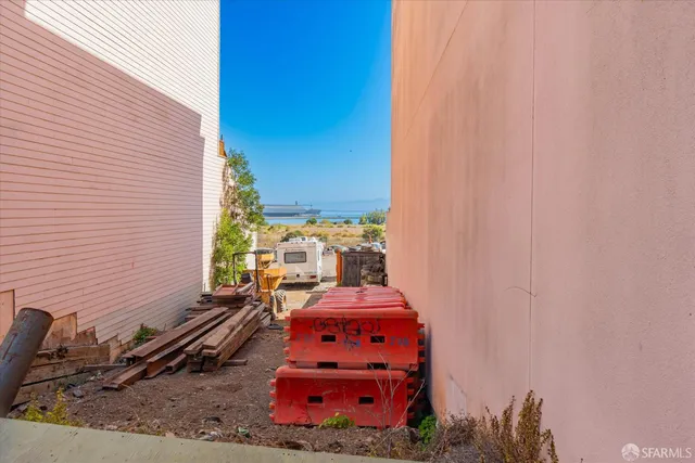 a view of a backyard with chairs