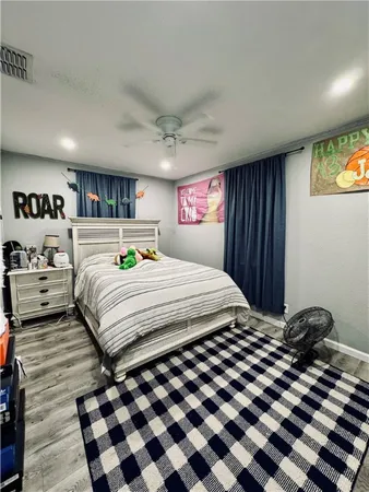 a bedroom with a bed and a dresser