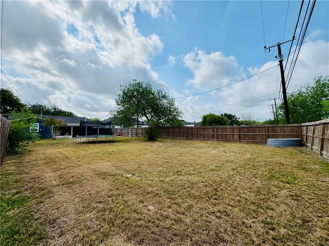 a view of a patio with a yard