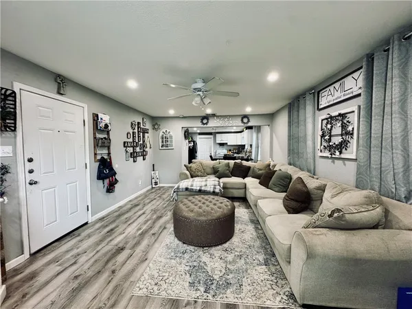a living room with furniture and a rug