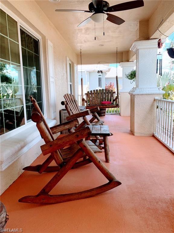 3303 32nd Street Southwest Lehigh Acres, FL 33976 - Photo 21 of 35 a room with gym equipment and a large window