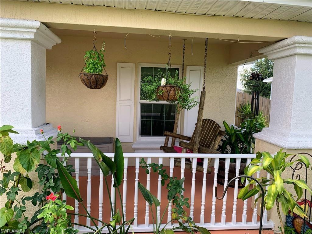 3303 32nd Street Southwest Lehigh Acres, FL 33976 - Photo 29 of 35 a front view of a house having yard