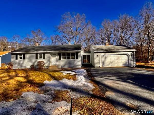 a view of a house with snow on the side of it