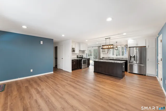 a view of kitchen with wooden floor