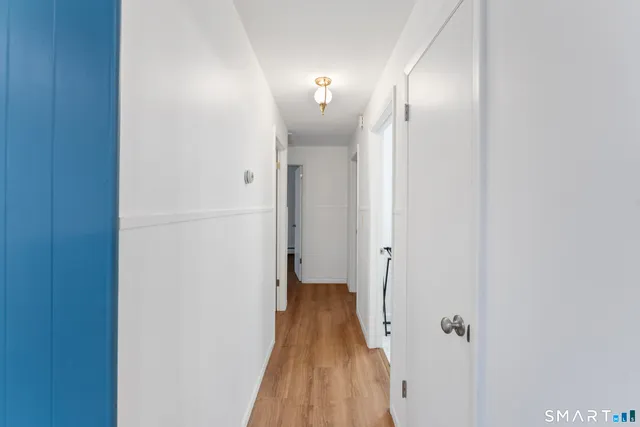 a view of a bathroom with a sink and mirror