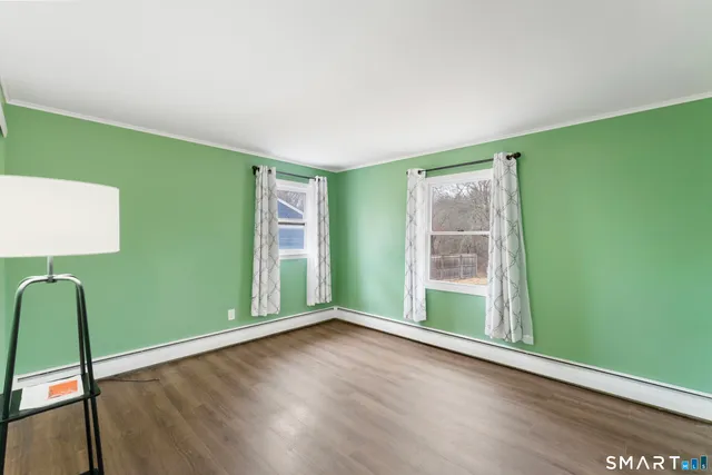 a view of room with window and hardwood