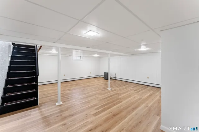 an empty room with wooden floor