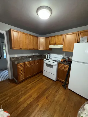 a bathroom with a toilet a sink and a shower