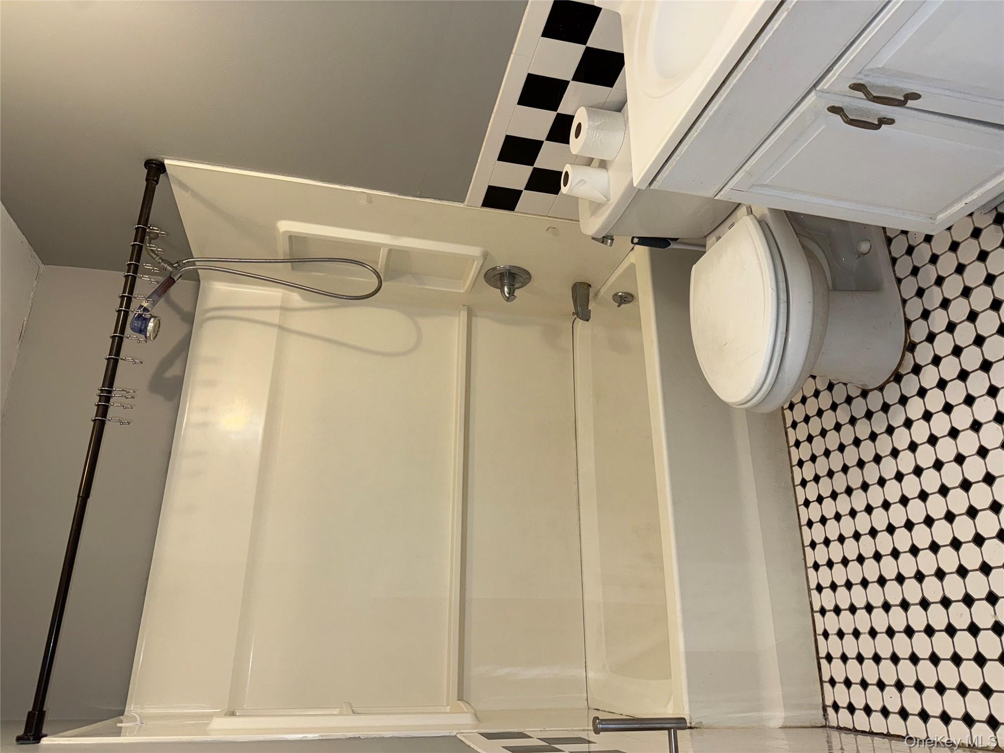 54 Gifford Avenue, Unit 2 Poughkeepsie, NY 12601 - Photo 12 of 19 a bathroom with a toilet a sink and a shower