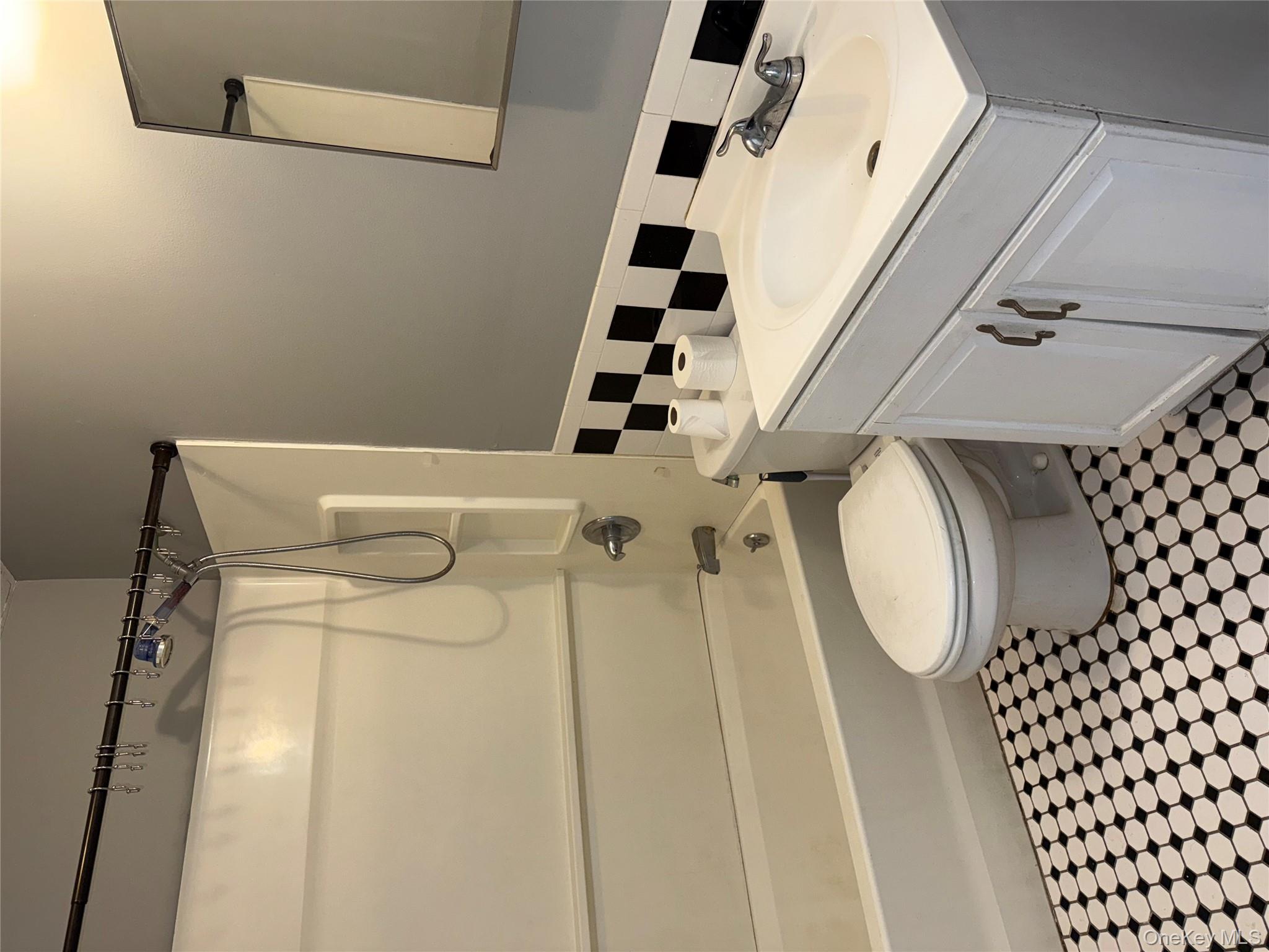 54 Gifford Avenue, Unit 2 Poughkeepsie, NY 12601 - Photo 13 of 19 a bathroom with a sink a toilet and shower